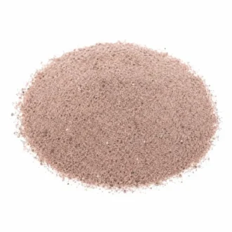 Fine pink Himalayan black salt powder pile isolated on white background
